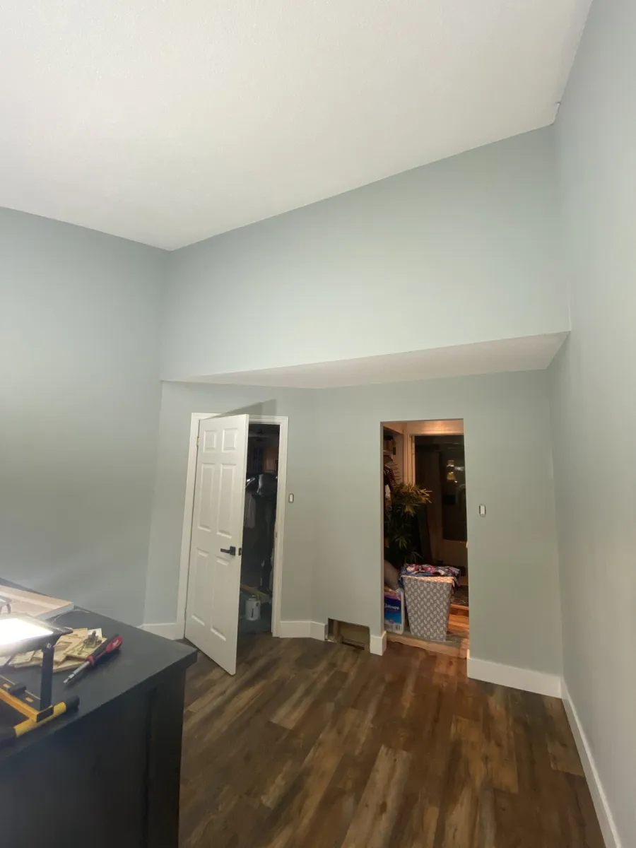Same hallway with crisp new white paint and clean trim